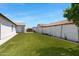 Spacious backyard with lush green grass, offering ample space for outdoor activities and relaxation at 17084 N Palo Pino St, Maricopa, AZ 85138