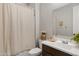 Bathroom featuring a vanity, toilet, framed mirror and shower with a curtain at 17084 N Palo Pino St, Maricopa, AZ 85138