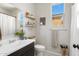 This bathroom features a single sink vanity, framed mirror, and a window for natural light at 17084 N Palo Pino St, Maricopa, AZ 85138