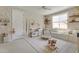 A bedroom featuring neutral palette, wallpaper, carpet, and a ceiling fan at 17084 N Palo Pino St, Maricopa, AZ 85138
