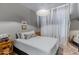 Calm bedroom featuring soft light, simple decor, and a large mirror, creating a serene retreat at 17084 N Palo Pino St, Maricopa, AZ 85138