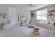 Playful room featuring custom millwork, bench seat, and designer wallpaper at 17084 N Palo Pino St, Maricopa, AZ 85138