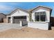 Attractive single-story home featuring a 3-car garage and drought-tolerant landscaping at 17084 N Palo Pino St, Maricopa, AZ 85138