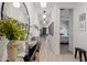Bright hallway with neutral colors, decorative lighting, and seamless access to the bedroom at 17084 N Palo Pino St, Maricopa, AZ 85138