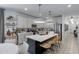 Bright kitchen with a central island, pendant lighting, and stainless steel appliances at 17084 N Palo Pino St, Maricopa, AZ 85138