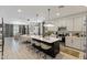 Open-concept kitchen with a large island, pendant lighting, and stainless steel appliances at 17084 N Palo Pino St, Maricopa, AZ 85138