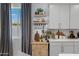 Charming kitchen details including open shelving, custom cabinets, and decorative displays at 17084 N Palo Pino St, Maricopa, AZ 85138