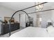 This main bedroom features a stylish four poster bed frame and ensuite bathroom at 17084 N Palo Pino St, Maricopa, AZ 85138