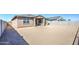 Large backyard with potential for custom landscaping, features block wall fence and side yard access at 17803 W Elm St, Goodyear, AZ 85395