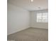 Cozy bedroom featuring neutral carpeting and a bright window at 17803 W Elm St, Goodyear, AZ 85395