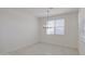 Bright dining room features chandelier and a window with horizontal blinds at 17803 W Elm St, Goodyear, AZ 85395