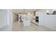 Spacious kitchen featuring stainless appliances and island with modern hanging lights at 17803 W Elm St, Goodyear, AZ 85395