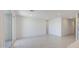 Bright living room features tile floors, recessed lighting, and a sliding glass door at 17803 W Elm St, Goodyear, AZ 85395