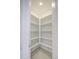 Walk-in pantry features bright white shelving at 17803 W Elm St, Goodyear, AZ 85395