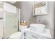 Modern bathroom featuring a vessel sink, framed mirror and a glass enclosed shower at 1803 E Palm Beach Dr, Chandler, AZ 85249