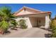 The exterior showcases a covered carport, desert landscaping, and the house number, 1803, by the front door at 1803 E Palm Beach Dr, Chandler, AZ 85249