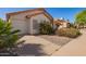 Beautiful home with a well-maintained lawn, manicured shrubbery and a two car garage at 1803 E Palm Beach Dr, Chandler, AZ 85249