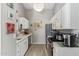 The kitchen features white cabinets, stainless steel appliances, and light gray walls at 1803 E Palm Beach Dr, Chandler, AZ 85249