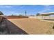 Spacious backyard with a mix of fence styles, offering lots of room for activities and future landscaping at 1944 W Osborn Rd, Phoenix, AZ 85015