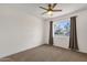 Bedroom with ceiling fan, natural light, and neutral colored carpet at 1944 W Osborn Rd, Phoenix, AZ 85015