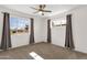 Spacious bedroom with a ceiling fan and two windows bringing in natural light at 1944 W Osborn Rd, Phoenix, AZ 85015