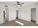 Bedroom with neutral carpet, white trim, a ceiling fan, and good natural light at 1944 W Osborn Rd, Phoenix, AZ 85015
