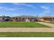 Charming brick home features a well-manicured lawn, classic white trim, and an attached carport for convenient parking at 1944 W Osborn Rd, Phoenix, AZ 85015