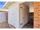 Exterior side access to a storage area, featuring brick accents and convenient accessibility from the yard at 1944 W Osborn Rd, Phoenix, AZ 85015
