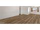 Bright living room featuring wood-look flooring, neutral walls, and natural light at 1944 W Osborn Rd, Phoenix, AZ 85015