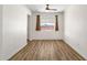 Bright living room showcasing wood-look flooring, neutral walls, and ceiling fan at 1944 W Osborn Rd, Phoenix, AZ 85015