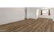 Spacious living room features modern flooring, neutral paint, and bright natural light, perfect for versatile living at 1944 W Osborn Rd, Phoenix, AZ 85015