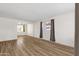 Spacious living room showcasing wood-look flooring, neutral walls, and lots of natural light at 1944 W Osborn Rd, Phoenix, AZ 85015