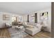 Bright living room features a neutral color palette, stylish furniture, and large windows for natural light at 1944 W Osborn Rd, Phoenix, AZ 85015