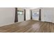 Bright living room showcases new floors, fresh paint, updated windows, and provides a blank canvas for personalization at 1944 W Osborn Rd, Phoenix, AZ 85015