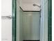 A light-green tiled shower stall with chrome fixtures and a shower curtain at 1944 W Osborn Rd, Phoenix, AZ 85015