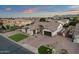Stunning aerial view of the property showcasing its well-manicured landscaping, expansive driveway, and tile roof at 20165 E Via Del Palo Dr, Queen Creek, AZ 85142