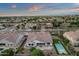 Stunning aerial view of a home with a private backyard pool and lush landscaping in a quiet neighborhood at 20165 E Via Del Palo Dr, Queen Creek, AZ 85142