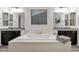 Bathroom featuring a soaking tub between two vanities, each with mirrors, lighting and granite counters at 20165 E Via Del Palo Dr, Queen Creek, AZ 85142