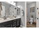 Bathroom featuring a double vanity, framed mirrors, and fixtures at 20165 E Via Del Palo Dr, Queen Creek, AZ 85142