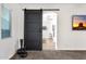 View of ensuite bathroom entrance from the bedroom with a rustic sliding door at 20165 E Via Del Palo Dr, Queen Creek, AZ 85142