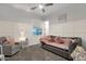 Cozy bedroom with wainscotting, a daybed with pink accents, and a comfortable sitting chair at 20165 E Via Del Palo Dr, Queen Creek, AZ 85142