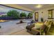 Comfortable covered patio area with outdoor seating and scenic backyard views at 20165 E Via Del Palo Dr, Queen Creek, AZ 85142