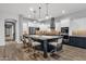 This kitchen features a large island with seating and modern stainless steel appliances at 20165 E Via Del Palo Dr, Queen Creek, AZ 85142