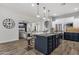 Spacious kitchen island with stainless steel appliances and seating for casual dining at 20165 E Via Del Palo Dr, Queen Creek, AZ 85142
