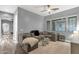 Comfortable living room with an oversized couch, a ceiling fan, and recessed lighting at 20165 E Via Del Palo Dr, Queen Creek, AZ 85142