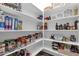Walk-in pantry with stocked shelves offers abundant storage space at 20165 E Via Del Palo Dr, Queen Creek, AZ 85142