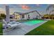 Sparkling pool with a lounge chair in the lush, private backyard at 20165 E Via Del Palo Dr, Queen Creek, AZ 85142