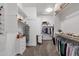 Organized walk-in closet with ample shelving and hanging space for clothes and accessories at 20165 E Via Del Palo Dr, Queen Creek, AZ 85142