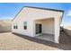 Backyard exterior featuring a covered patio and light stucco on this single-story home at 25283 N 183Rd Dr, Wittmann, AZ 85361