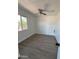 Comfortable bedroom with a ceiling fan and a bright window at 2853 W Ohio St, Apache Junction, AZ 85120
